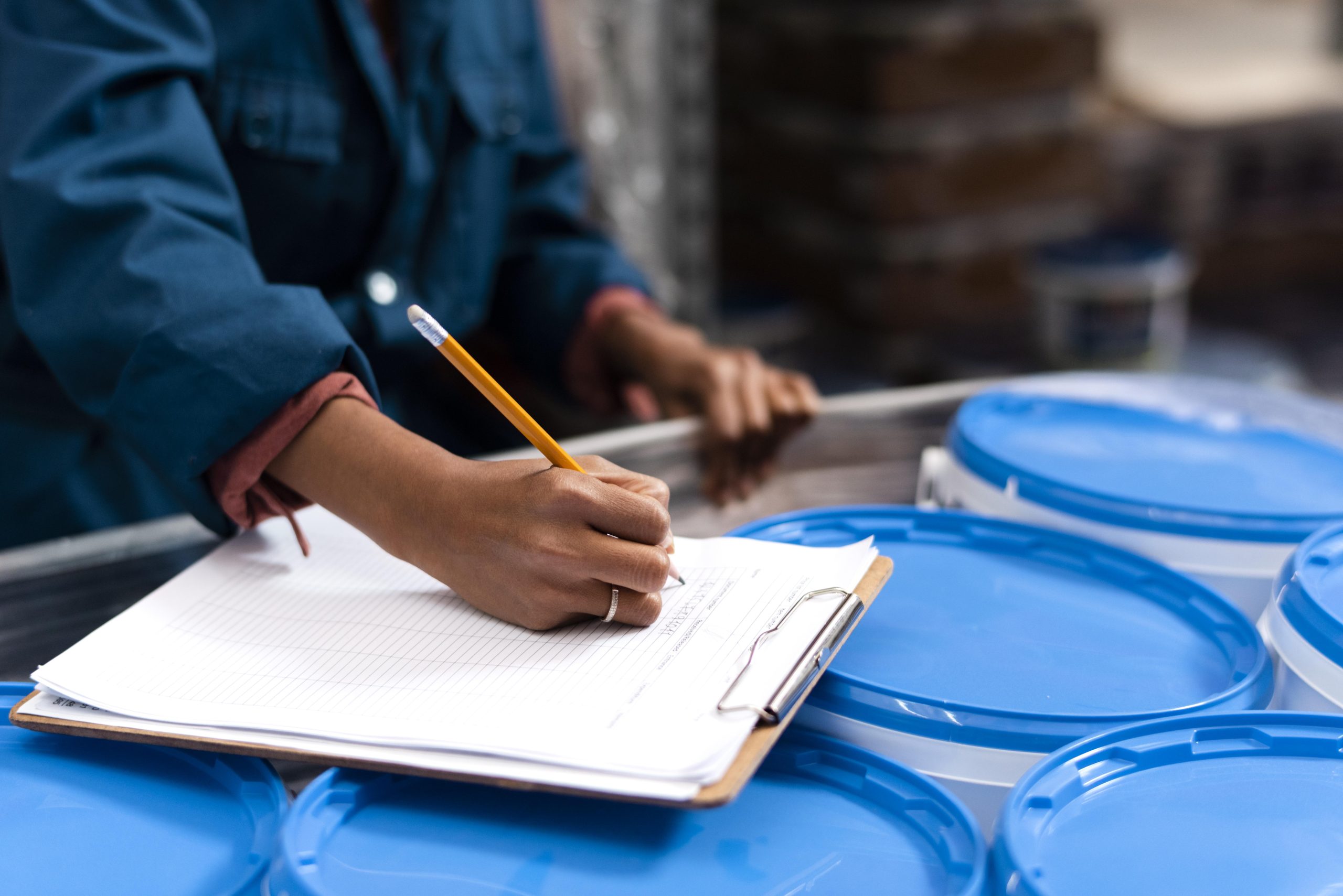 woman-worker-taking-notes-warehouse